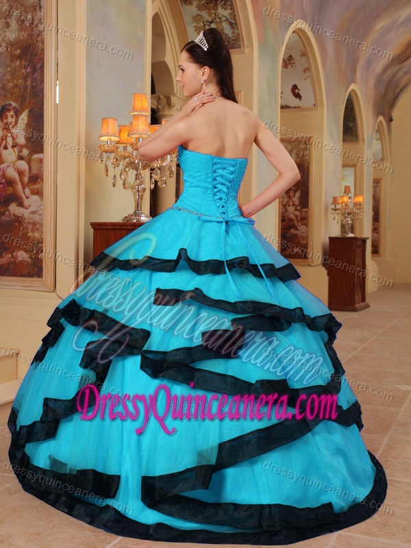 Aqua Blue Beaded Sweet Sixteen Quince Dresses with Layers and Black Hemline