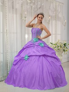 Lavender Strapless Taffeta Beaded Dress for Quince with Pick-ups and Green Flowers