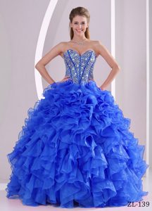 Elegant Sweetheart Beaded Blue Organza Quinceaneras Dress with Ruffles