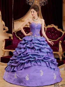 Appliqued Purple New Quinceanera Dress with Sweetheart Neckline and Pick-ups